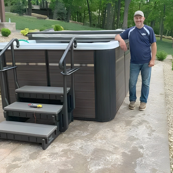 Man standing by new hot tub steps.